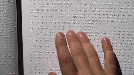 person reading braille book