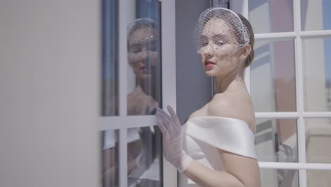elegant bride by the window