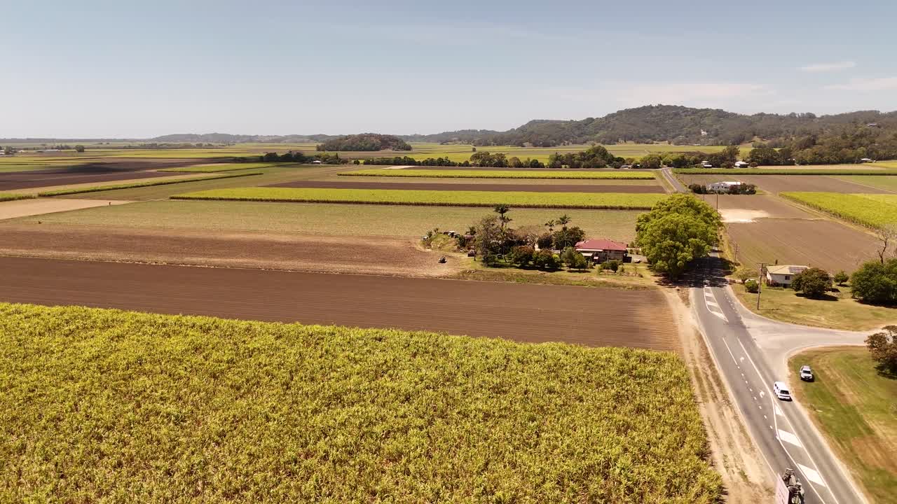 Drone footage panning across the Tweed Valley Way near cane fields in northern New South Wales
