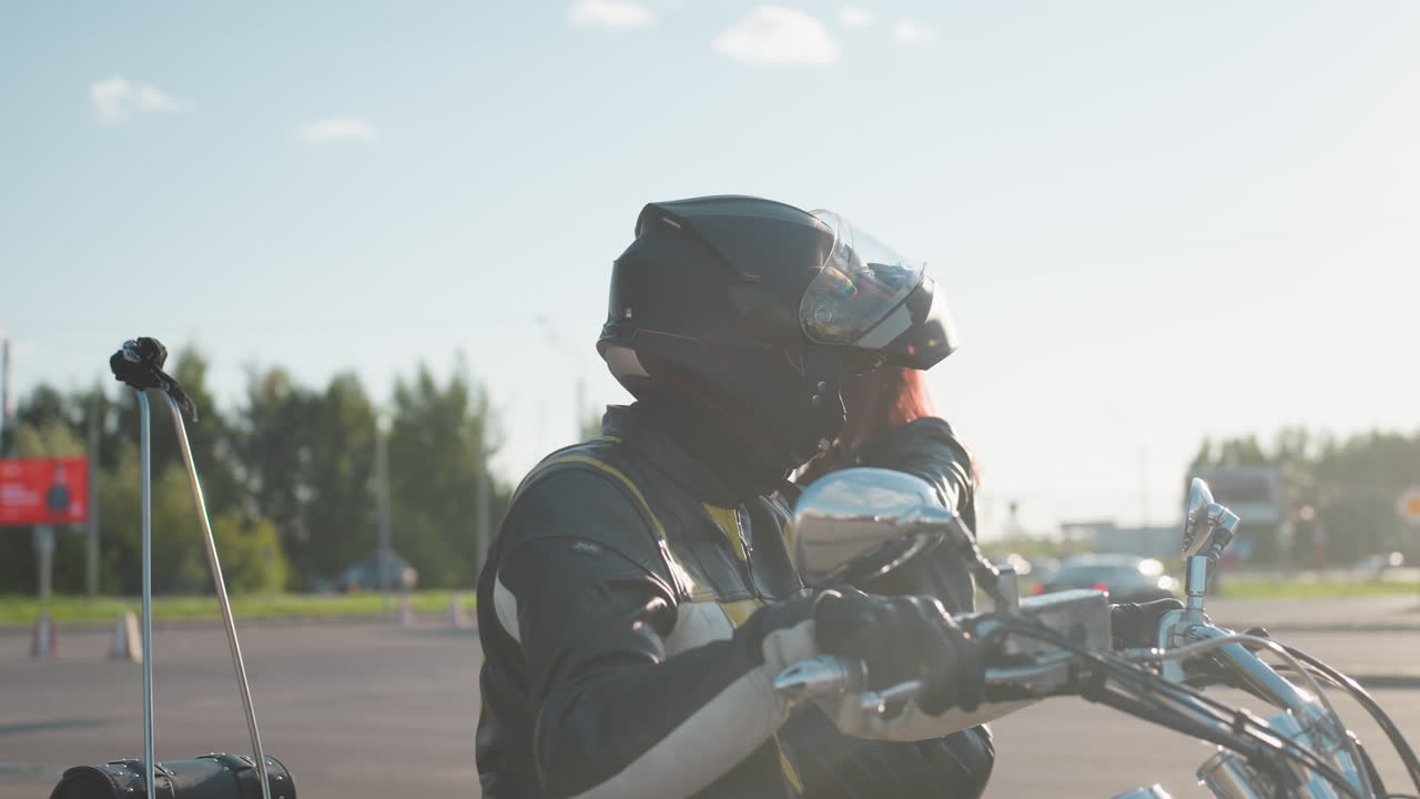 Side view of woman climbing onto motorcycle while holding rider, sunlight flare glowing around helmet and chrome, dynamic outdoor scene showing biker lifestyle and freedom with motion