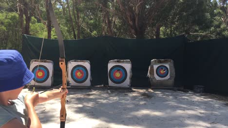 young australian girl archer aiming to target