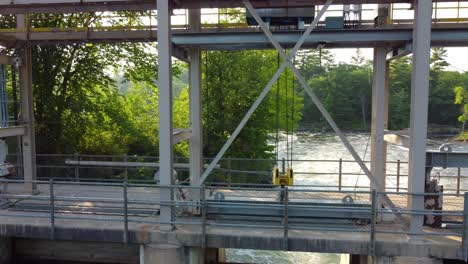 aerial footage of floodgate controlling flow in river, flood prevention