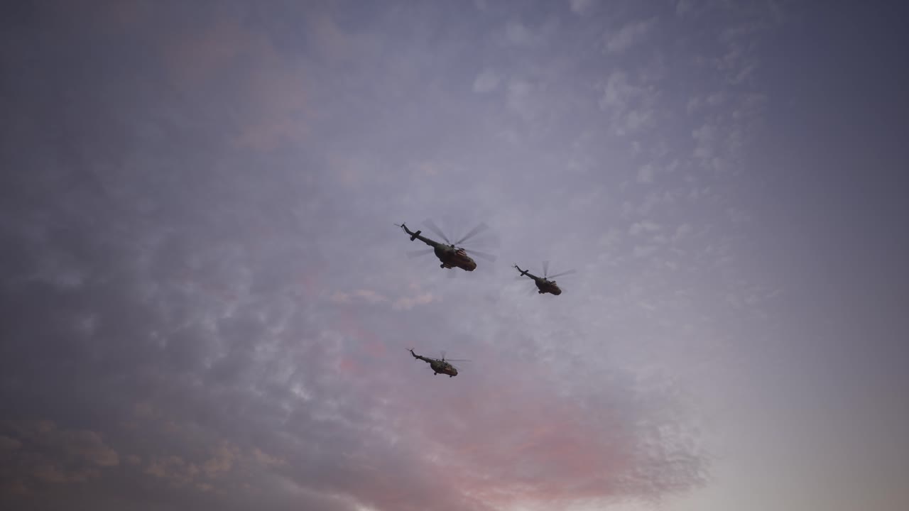 Military Helicopter Formation Flying At Sunset Or Sunrise Through Cloudy Sky