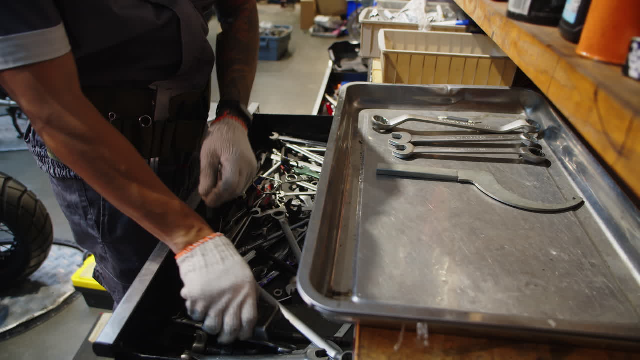 Unrecognizable Mechanic Preparing Instruments when Working in Garage