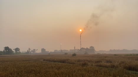 establisher view of industry pipe releasing fumes in air, bangladesh, pan