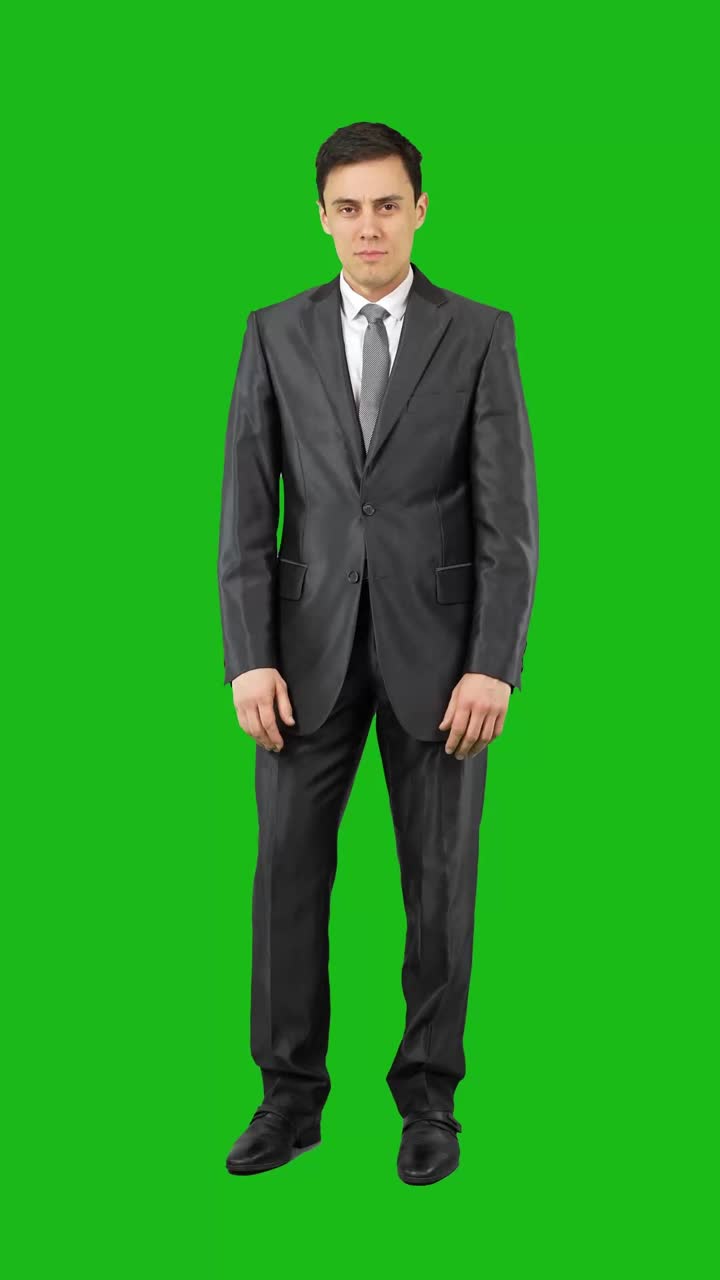 Man in Suit Standing and Posing on Green Screen