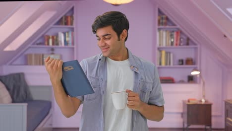 Happy-Indian-boy-reading-a-book