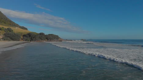 AERIAL:-Fly-over-surf-at-Mount-Maunganui-clip-2