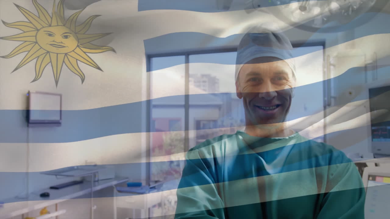 Animation of flag of uruguay over caucasian male surgeon in hospital