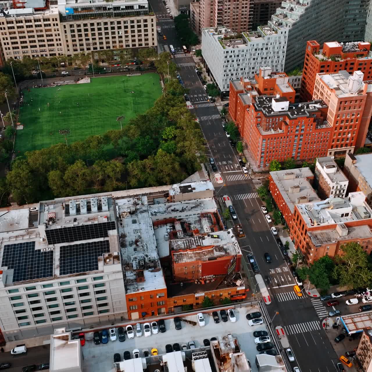 Average residential area in New York. Green stadium for baseball games in the centre of community. Top view