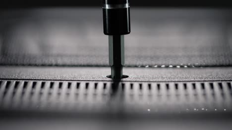 manual screwdriver tightening a cross-head screw on a laptop casing, highlighting precision, hardware repair, and computer maintenance