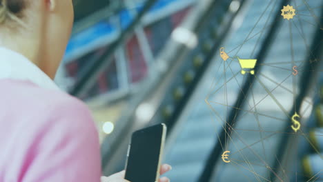 Animation-of-retail-network-over-caucasian-businesswoman-using-smartphone-on-escalator