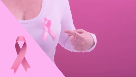 Animation-of-pink-breast-cancer-ribbon-over-caucasian-woman
