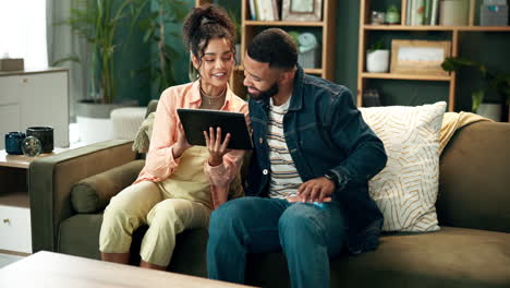couple using tablet together at home