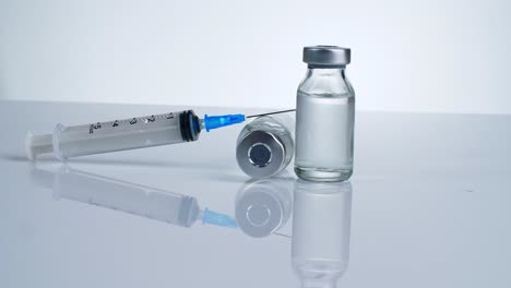 syringe and vaccine vials