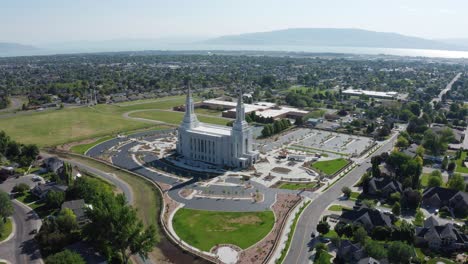 aerial view of the lindon utah lds temple with a new empty parking lots with lindon city and utah lake in the background (before dedication)