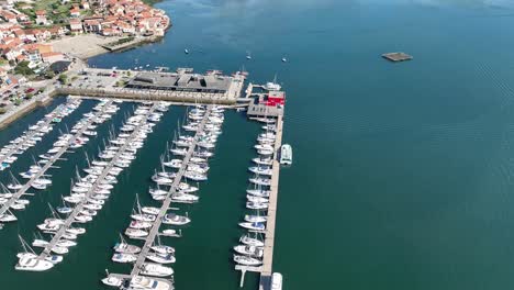 Sunny-Day-Over-Combarro's-Harbor-and-Sailboats---aerial-bird´s-eye