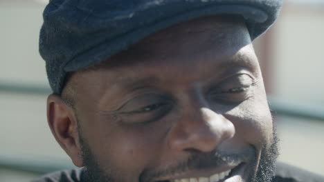 close-up shot of happy afro-american gay man smiling