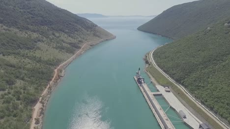 sea shore inlet with industrial structure  pan up