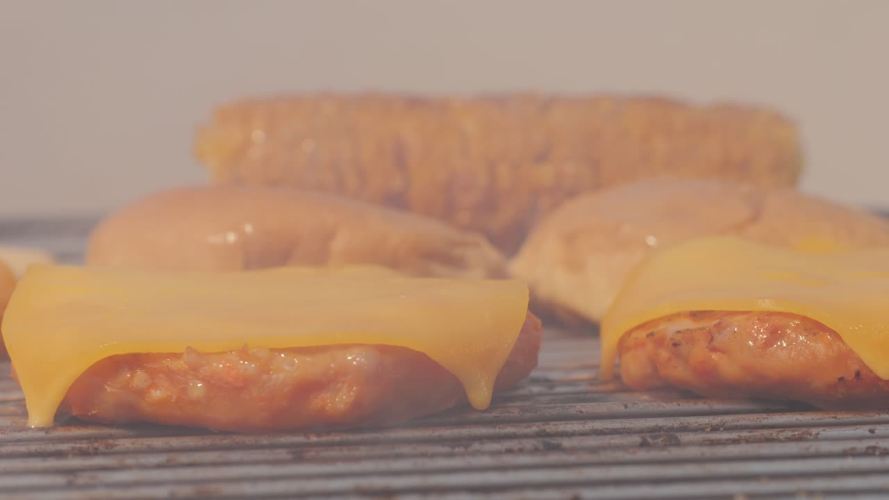Veggie orange burger on grill, carrot and oats burger with corn and yellow pepper, vegetarian food barbeque, potato grill burger.