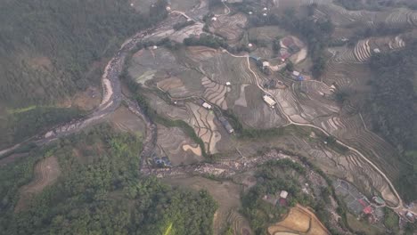 From-above,-textures-of-rice-paddy-fields-and-river-water