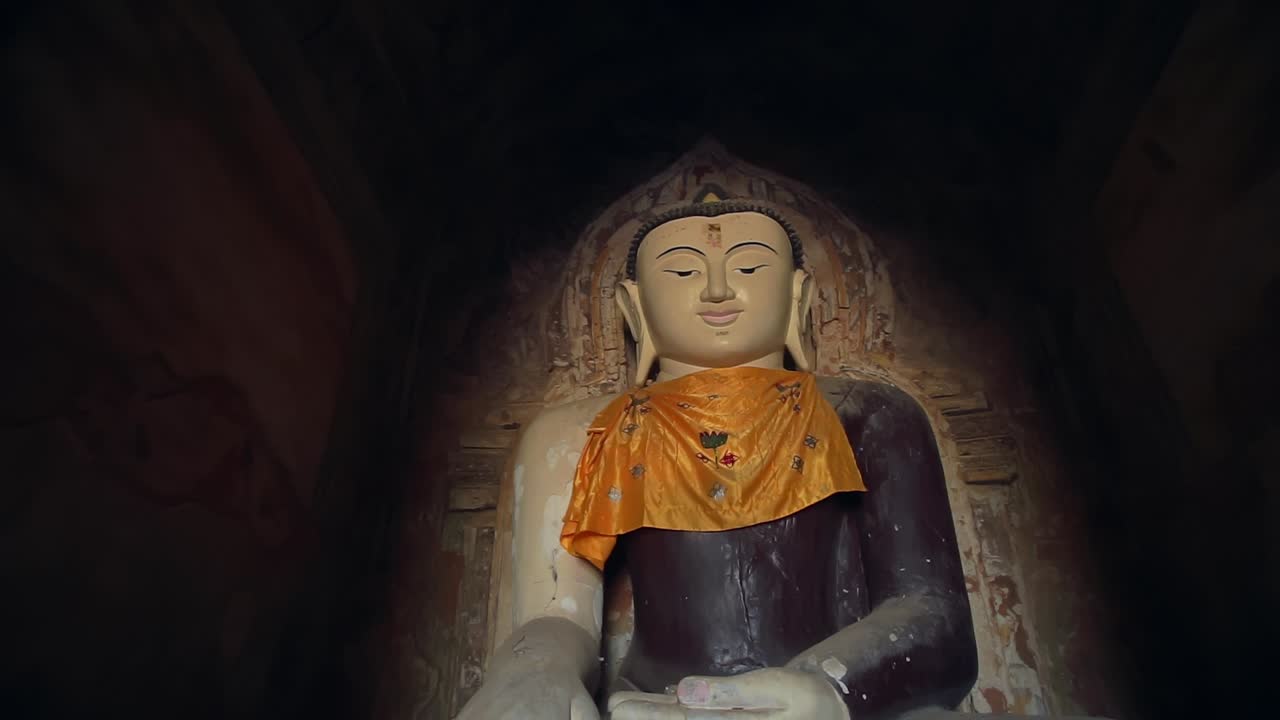 A detailed view of ancient wall art at Ananda Temple in Bagan, Myanmar, depicting a Yidam or Buddha figure. A beautiful display of traditional Buddhist artistry and history.