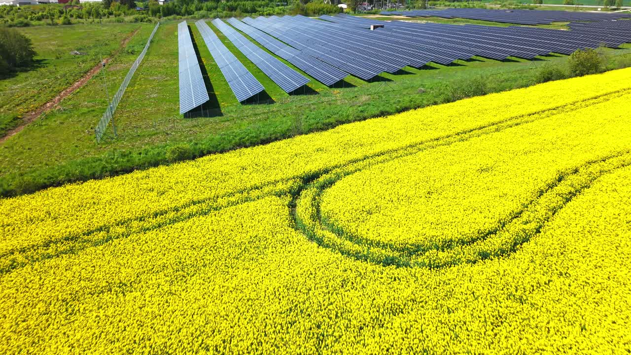 Aerial drone overview of solar grid installed in open farmland, energy and environment focus