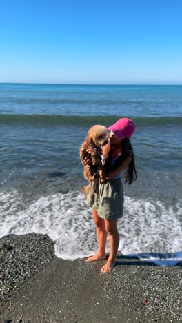 woman and dog at the beach