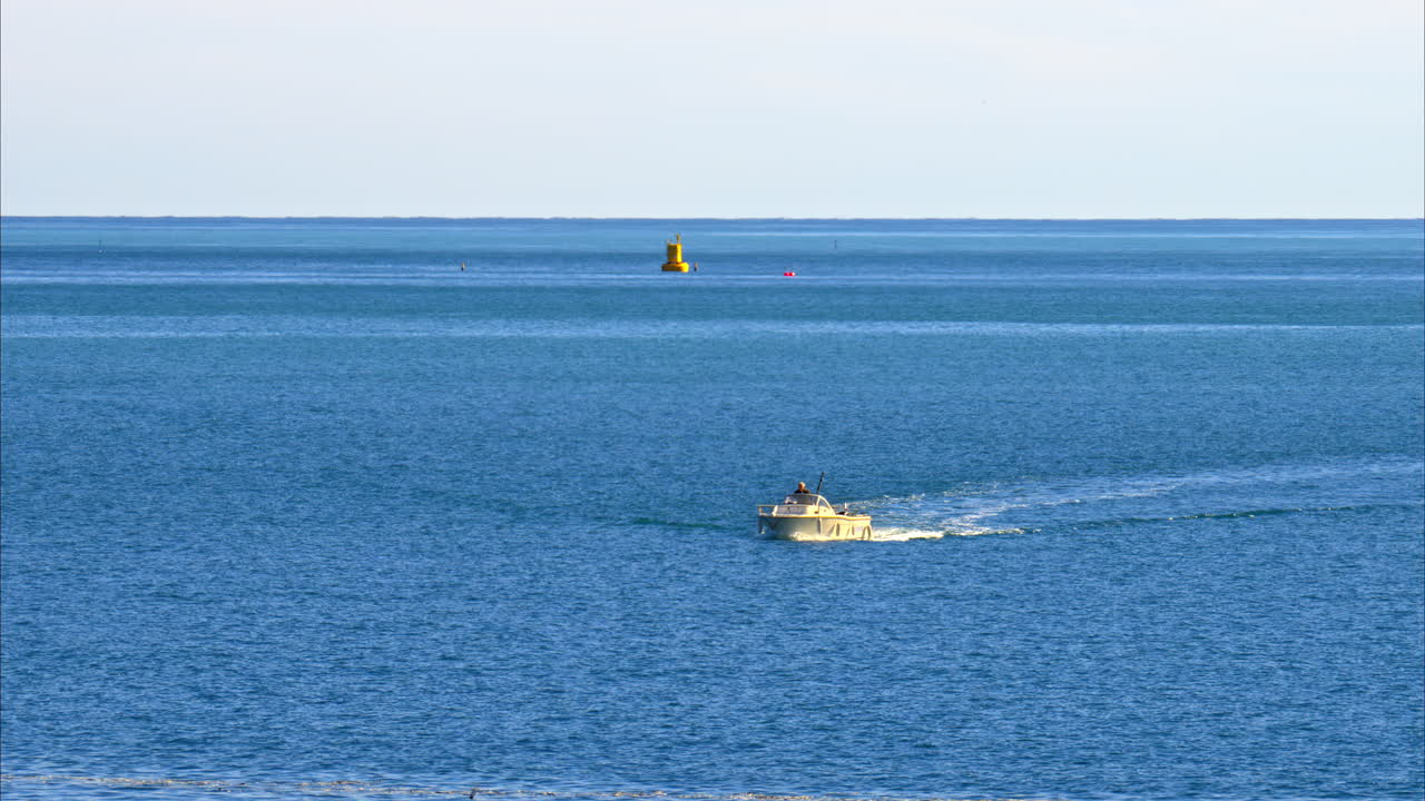 White boat moving on the Ligurian Sea near Villefranche-sur-Mer on the French Riviera