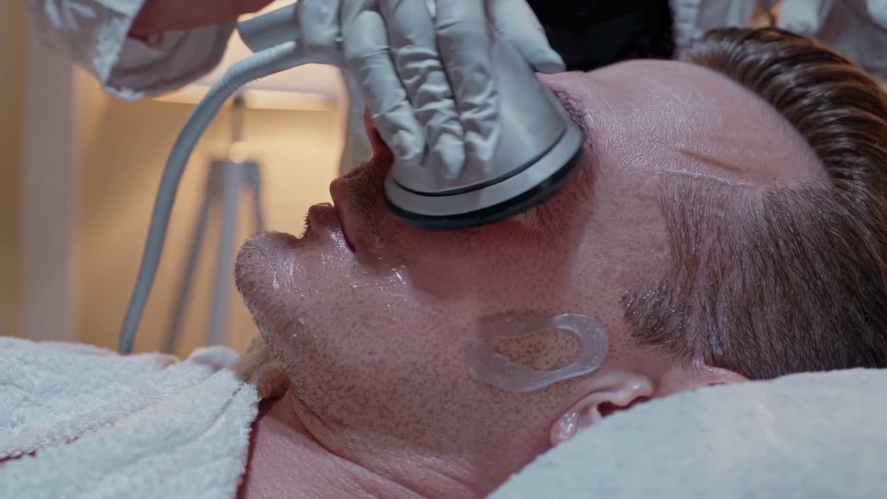 Man Receiving Facial Treatment at a Spa