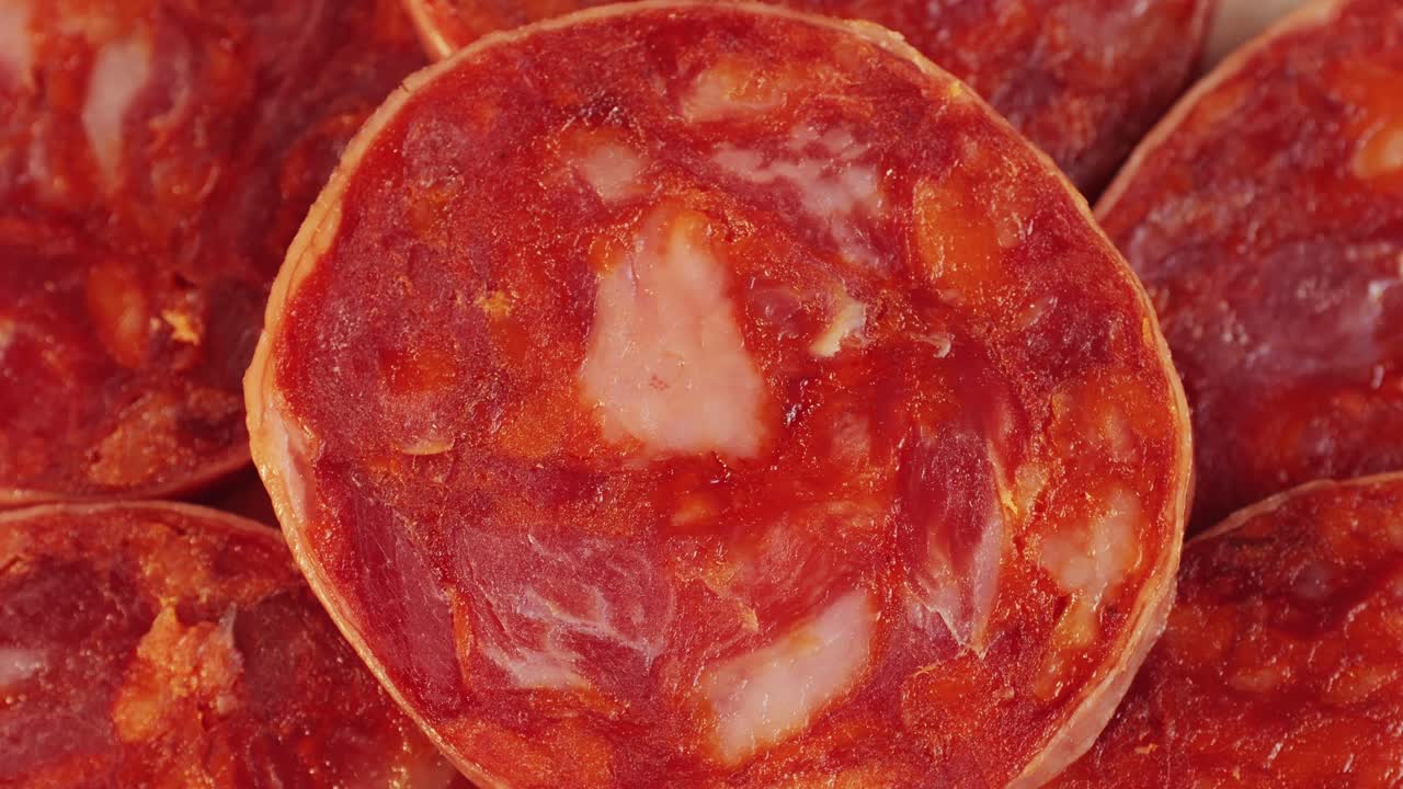 Mix of spanish pork sausages, Cutting board of appetizing catalonian snack - fuet, jamon, chorizo, olives, supermarket tapas food in spain, traditional cuisine.