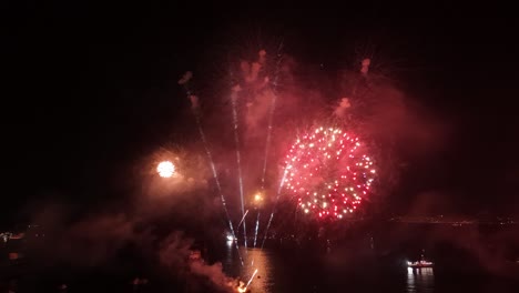 Aerial orbit establishing at the New Year&#039;s Eve fireworks festival in the city of Valparaiso Chile - Illuminated City