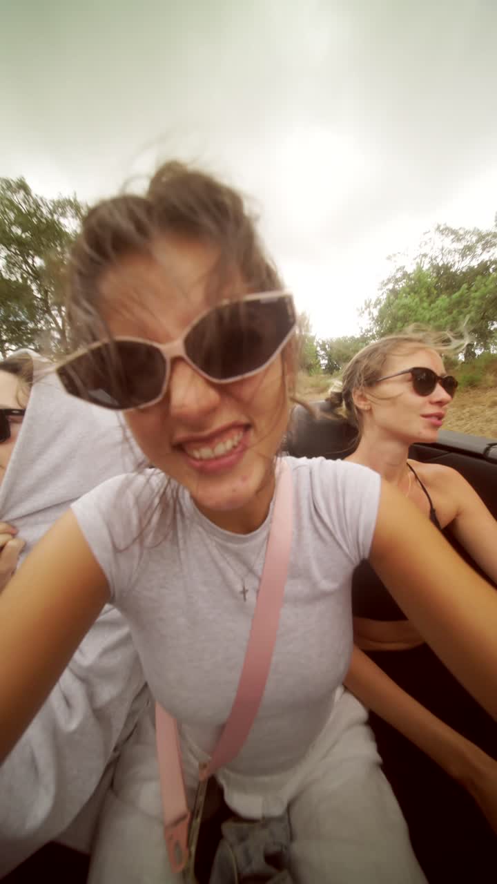 Friends on a road trip in a convertible