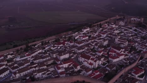 wide shot of medieval portuguese town obidos surrounded fortress wall, aerial