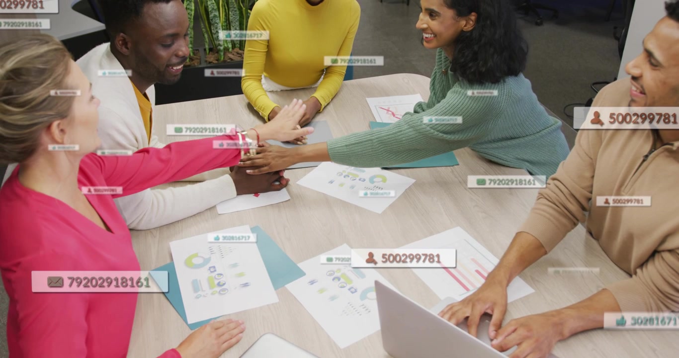 Team reviewing charts, teammate sliding sheet, data overlaying papers, stacking hands for business