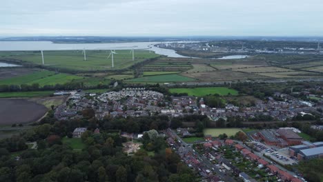 Aerial-view-above-Halton-North-England-Runcorn-Cheshire-countryside-wind-turbines-industry-landscape-flying-forward-zoom-in