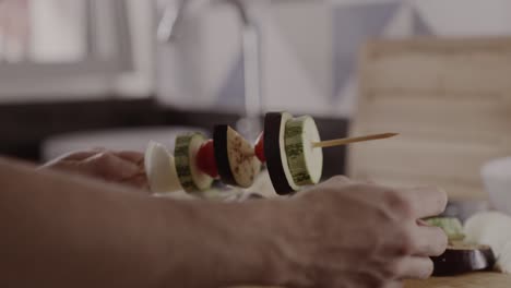 preparing vegetable skewers