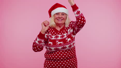 Mature-Christmas-grandmother-woman-dancing-trendy-dance-for-social-media-fooling-around-having-fun