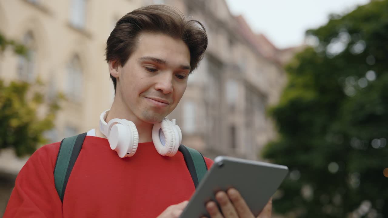 Man using tablet in city