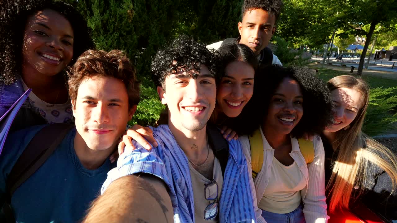 Group of Diverse Young Adults Taking a Selfie Together Outdoors