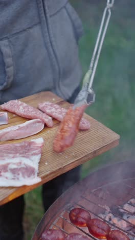 grilling sausages and meat outdoors