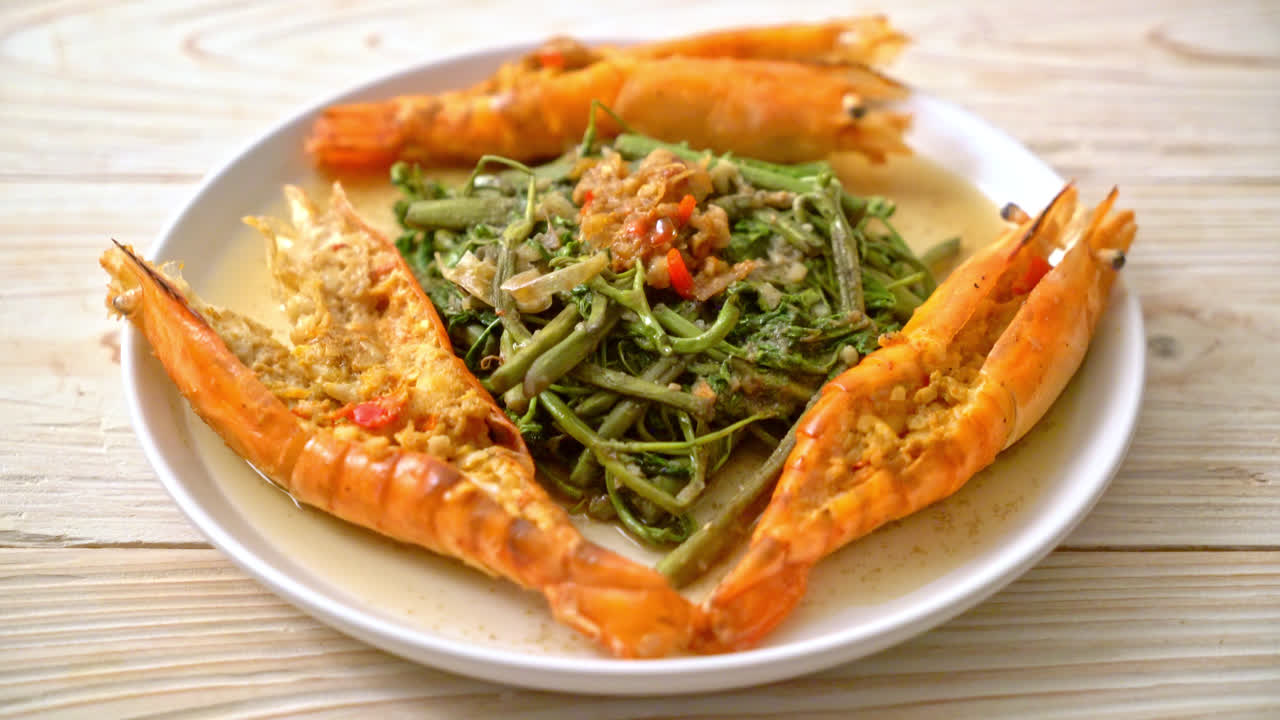 Stir-fried water mimosa with river prawns