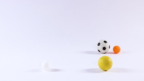 various balls bouncing and interacting dynamically