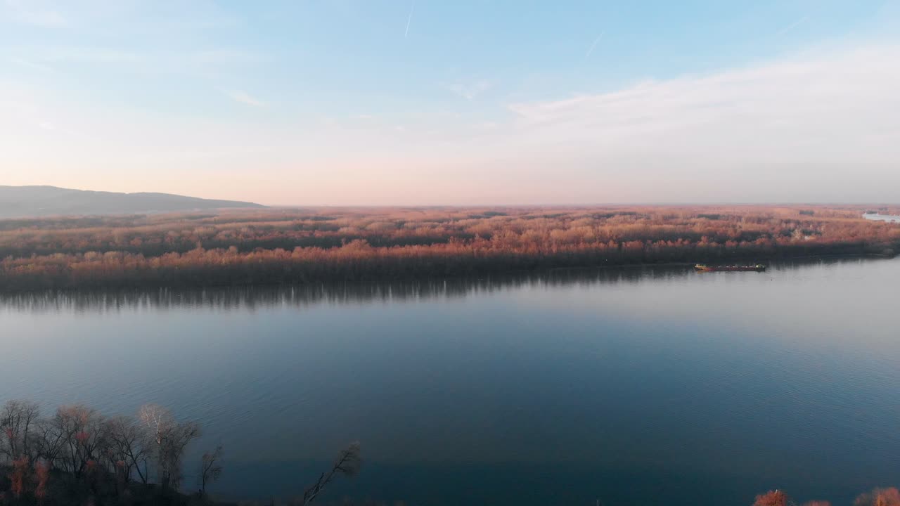 Wonderful aerial view of Danube river, a nature painting, beautiful mountains in the background, Pan camera.