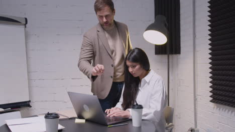 man and woman having a business meeting in boardroom 5