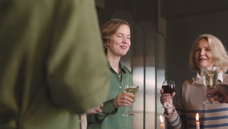 happy family standing and toasting each other while having dinner together at home