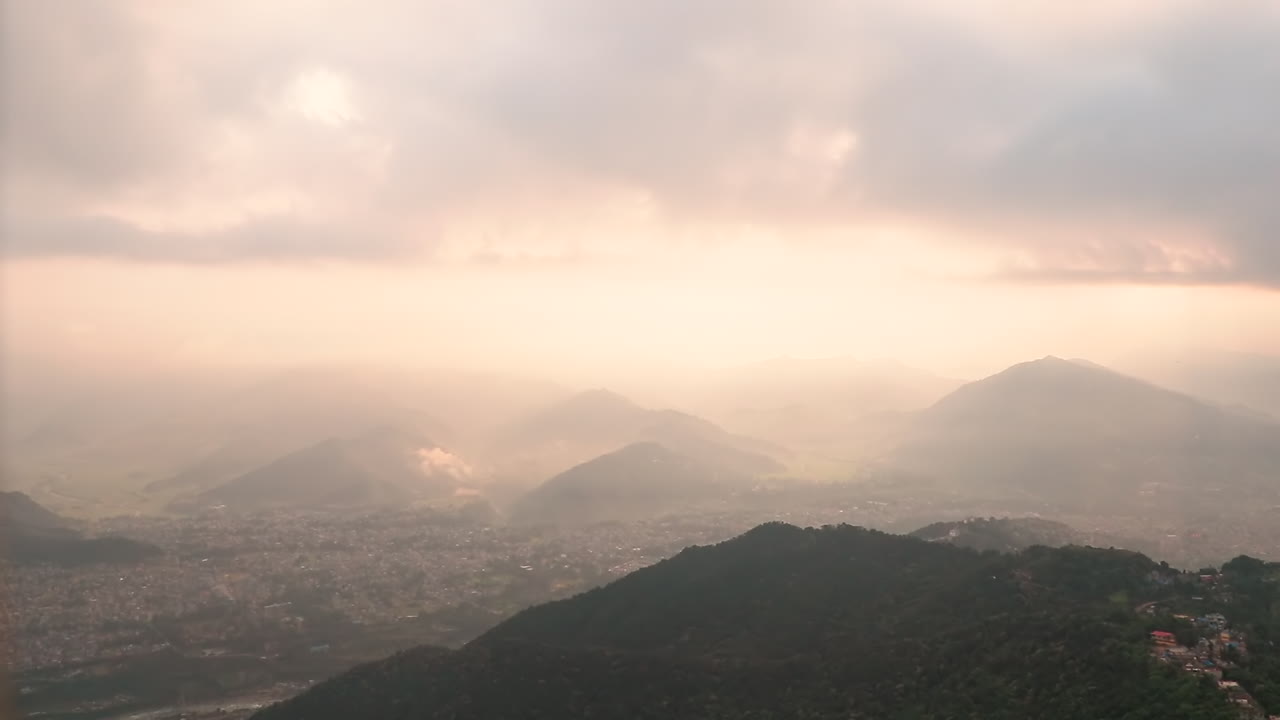 Aerial View OF Surreal Mountainous Landscape Covered in Fog During Sunrise. Timelapse video
