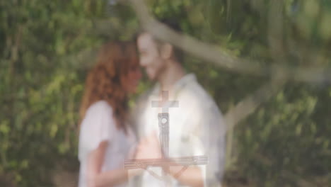 couple exploring religious education outdoors, engaging with floating crucifix animation overlay