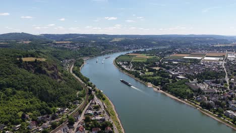 rhine river at remagen, shipping over the river. vessels, transport, industrial shipping. aerial video