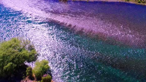 colored river in argentinian patagonia, in the middle of the desert